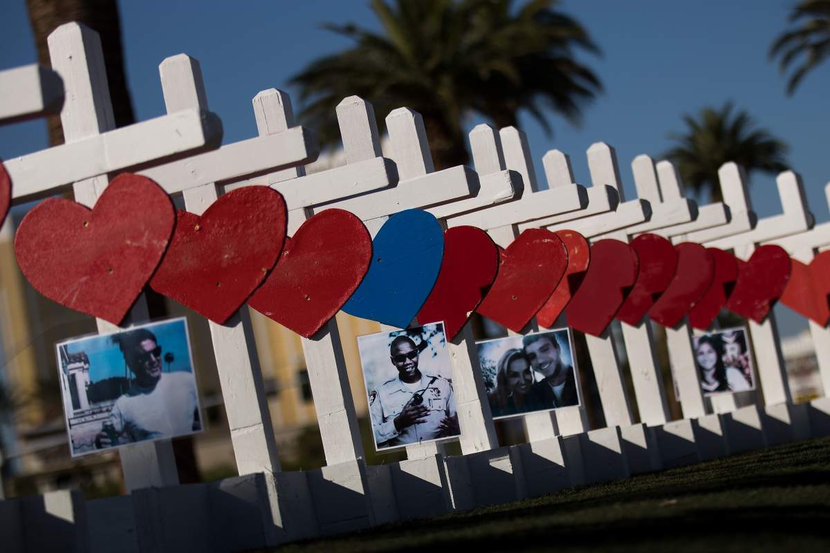 Fifty-eight white crosses for the victims of Sunday night’s mass shooting stand on the south end of the Las Vegas Strip, October 5, 2017 in Las Vegas, Nevada.