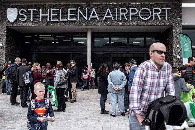 Travellers and passengers leave after disembarking from the first commercial plane to land at the newly built Saint Helena Airport, Oct. 14, 2017.