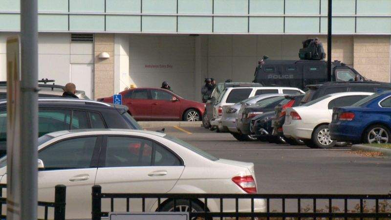 Calgary police respond to the Sheldon M. Chumir health centre in southwest Calgary on Thursday, Oct. 11, 2017 after a man was spotted inside a vehicle with a gun.