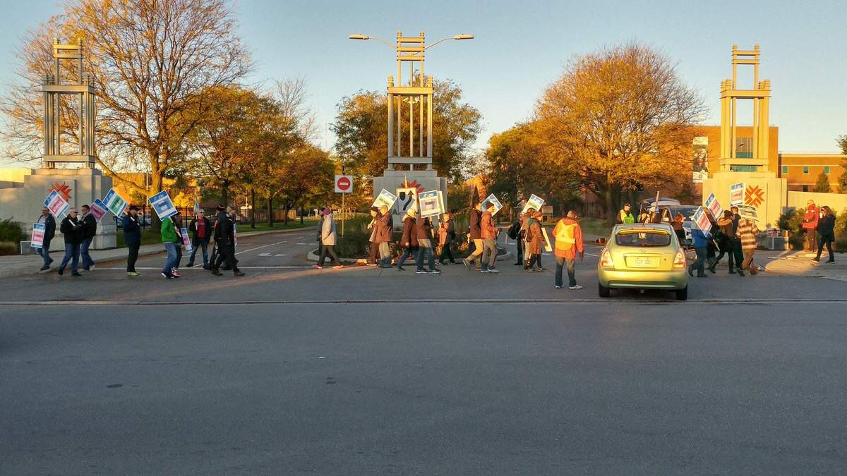 Striking faculty members picket outside Fanshawe College on Oct 16, 2017.