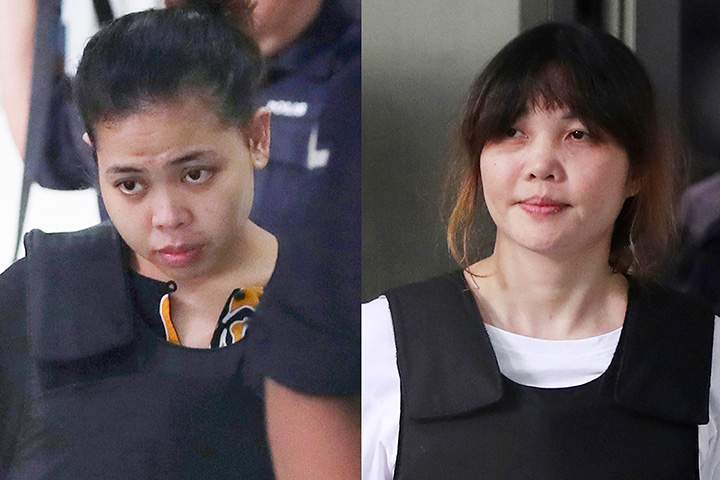 In this combination of the Oct. 2, 2017 file photos, Indonesian Siti Aisyah, left, and Vietnamese Doan Thi Huong, right, are escorted by police as they leave their court hearing at Shah Alam court house in Shah Alam, outside Kuala Lumpur, Malaysia.