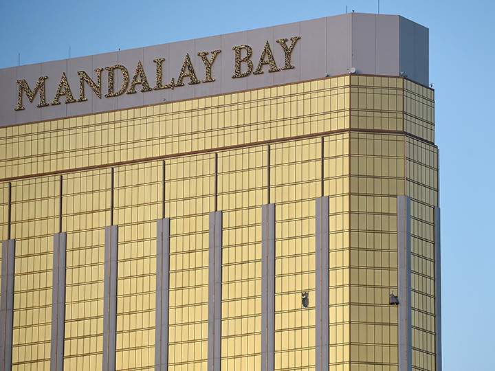 Broken windows are seen on the 32nd floor of the Mandalay Bay Resort and Casino after a lone gunman opened fire on the Route 91 Harvest country music festival on October 2, 2017 in Las Vegas, Nevada.