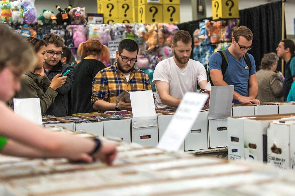 Fans browse comic books at London Comic Con, Oct 13-15 2017.