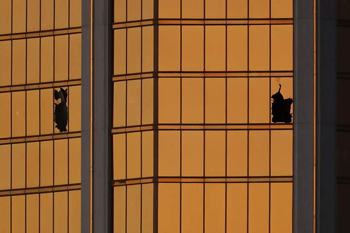 Morning light reflects off the Mandalay Bay Hotel and the broken windows where shooter Stephen Paddock conducted his rampage from the 32nd floor in Las Vegas, Nevada, October 3, 2017.