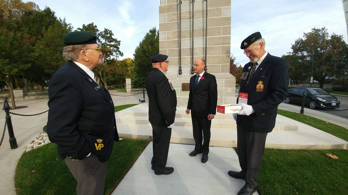 Mayor Matt Brown receives the first poppy of 2017 for the City of London.