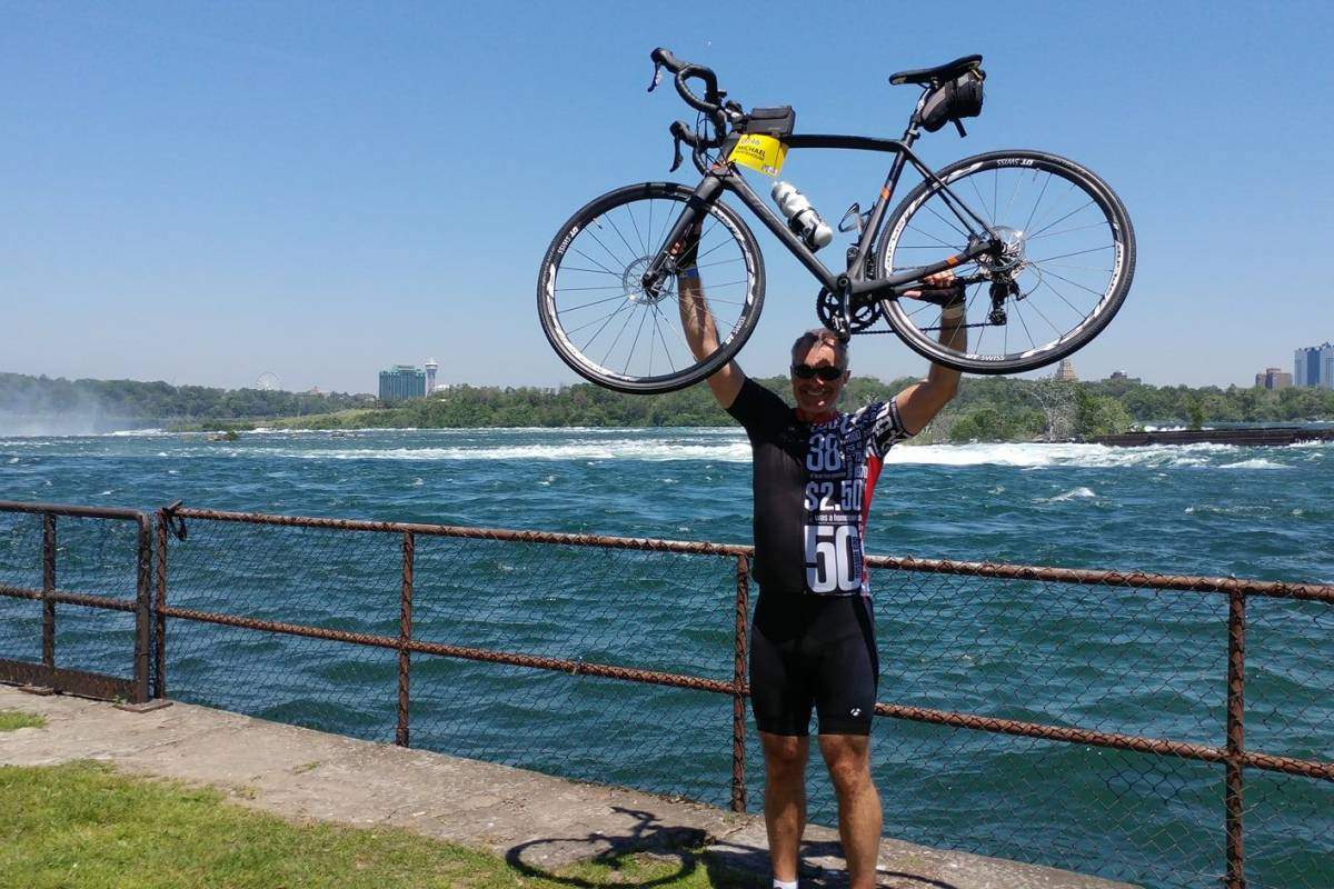 Erin McGuire’s brother-in-law, Michael Whitehouse, is seen here wearing the cycling jersey featuring McGuire’s Tragically Hip-inspired artwork.