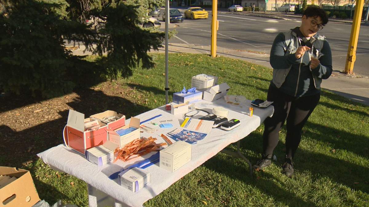 A group set up a mock safe injection site outside Regina's city hall on Wednesday to educate the public about their benefits.
