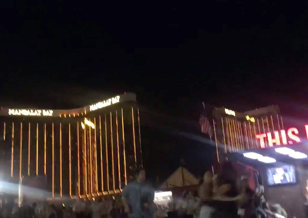 People run outside the Mandalay Bay Hotel after a gunman opened fire on attendees of the Route 91 Harvest Music Festival in Las Vegas, U.S., October 1, 2017 in this still image obtained from social media video.