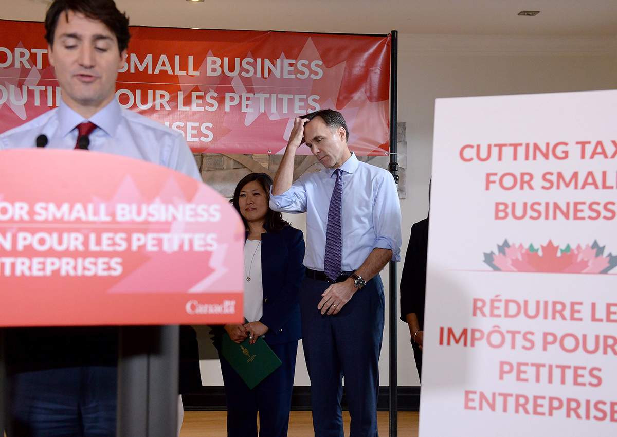 Finance Minister Bill Morneau looks on as Prime Minister Justin Trudeau speaks to members of the media at a press conference in Stouffville, Ont., on Monday, October 16, 2017. 