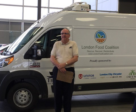 Ark Aid Mission executive director Doug Whitelaw, a founding partner of the coalition, stands in front of a new truck that will be used to help distribute food.