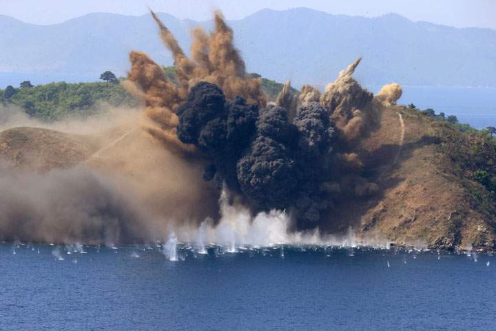 A target island is hit by artillery