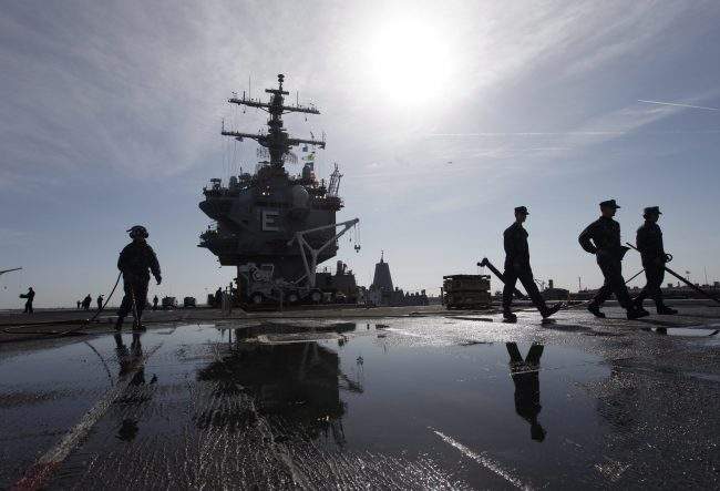 Sailors prepare for the deployment of the nuclear aircraft carrier USS Enterprise at the Norfolk Naval Station in Norfolk, Va., March 8, 2012.