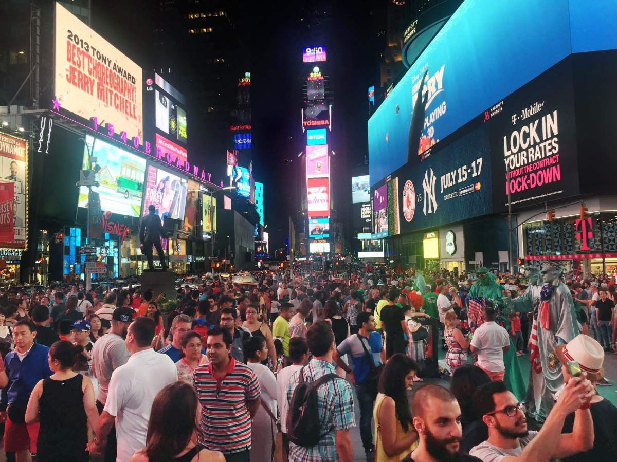In this Saturday, July 16, 2016, photo, crowds of visitors linger in New York’s Times Square – one of El Bahnasawyintended targets.