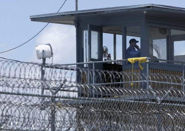 A guard is shown in a tower at the Arkansas Department of Correction Tucker Unit near Tucker, Ark., May 13, 2011.