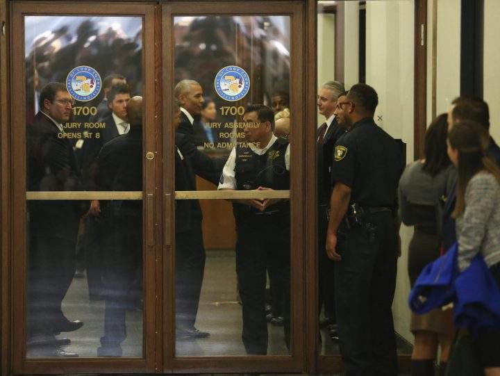 Former President Barack Obama arrives for jury duty in the Daley Center on Wednesday, Nov. 8, 2017, in Chicago.