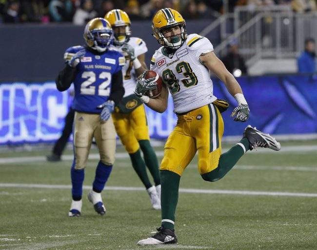 Edmonton Eskimos' Brandon Zylstra (83) celebrates his touchdown against the Winnipeg Blue Bombers during second half CFL western semifinal action in Winnipeg, Nov. 12, 2017. 