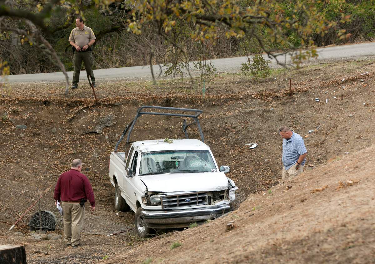 Investigators view a pickup truck involved in a deadly shooting rampage at the Rancho Tehama Reserve, near Corning, Calif., Tuesday.