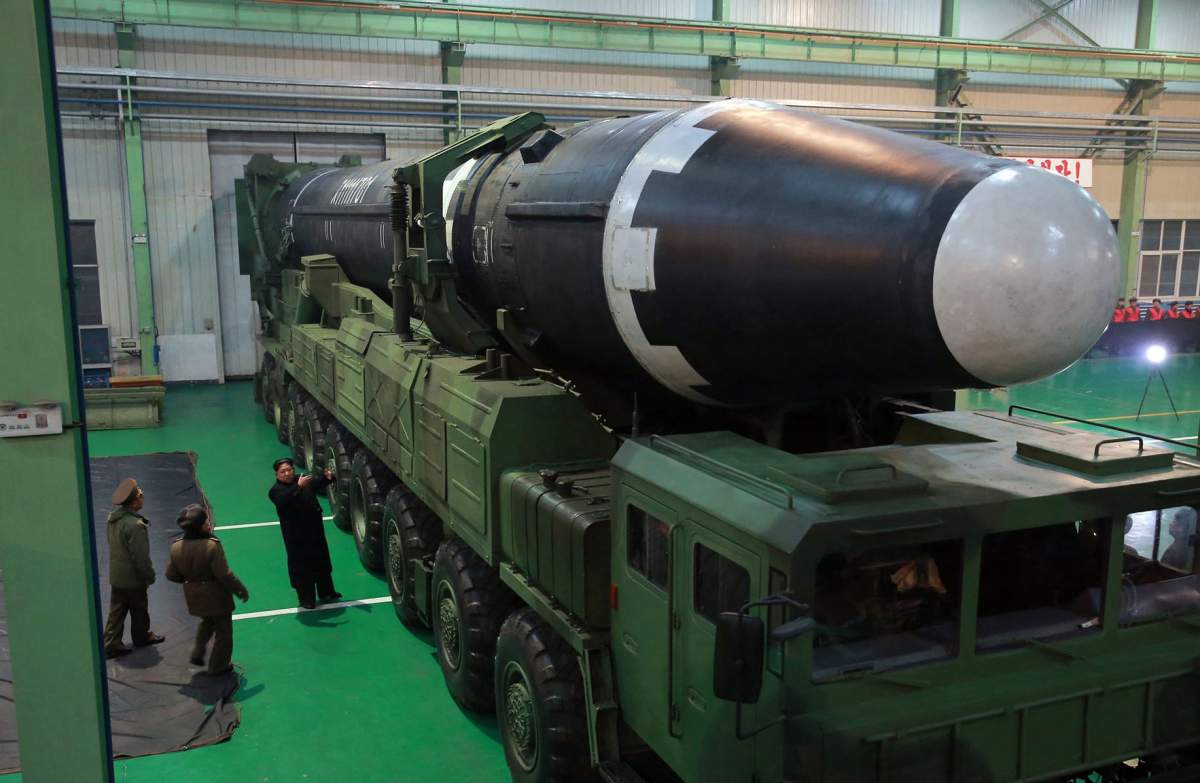 This Nov. 29, 2017, image provided by the North Korean government, shows Kim Jong Un and what the North calls the Hwasong-15 intercontinental ballistic missile.