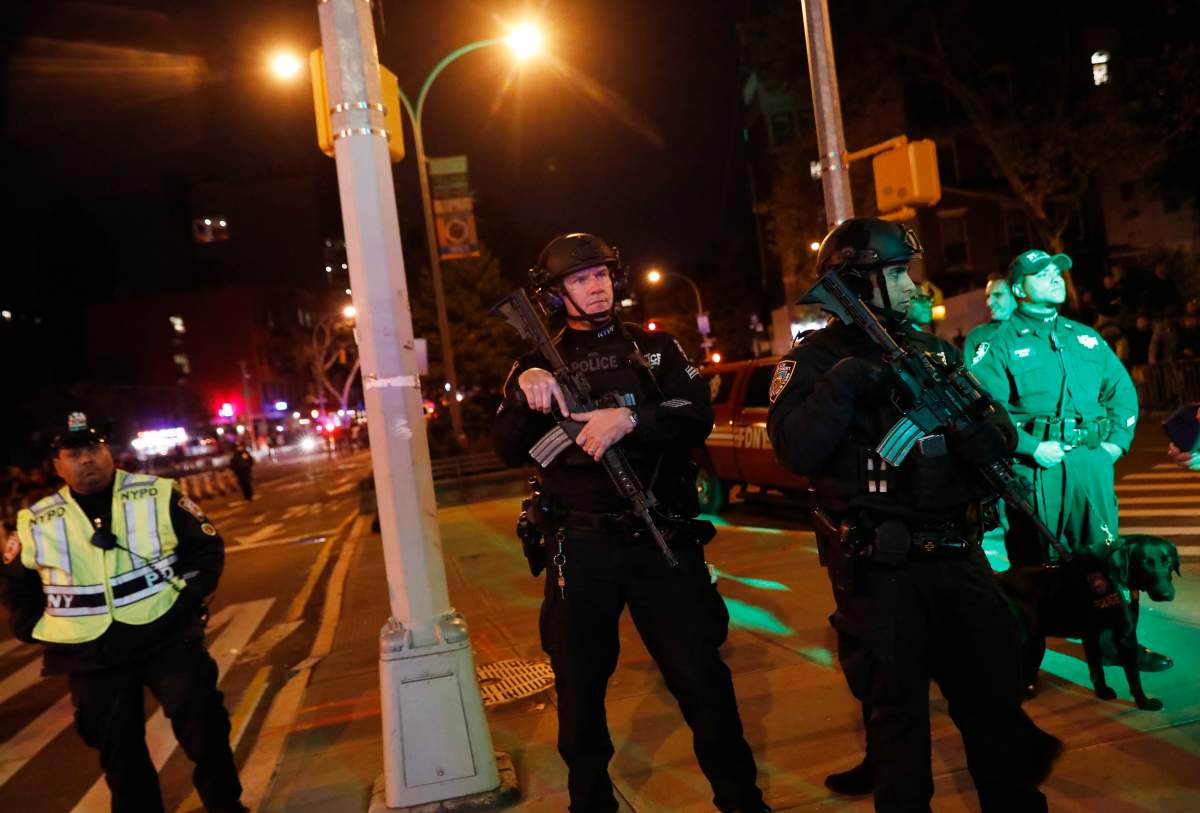 Heavily armed police officers guard the New York City Halloween parade after an earlier shooting in New York City, U.S. October 31, 2017.
