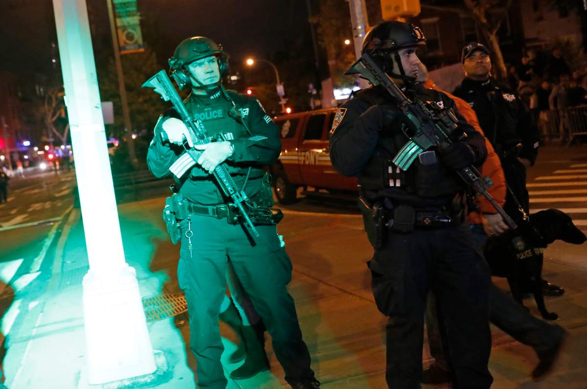 Heavily armed police officers guard the New York City Halloween parade after an earlier shooting in New York City, U.S. October 31, 2017.