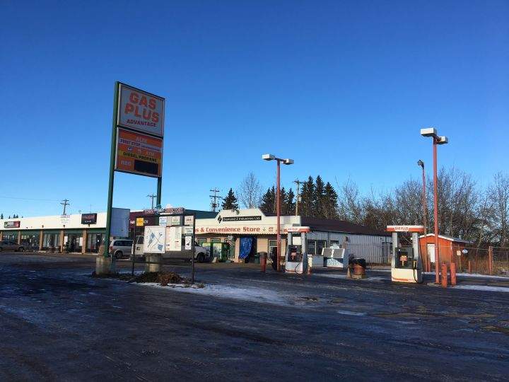 The owner of Gas Plus Advantage in Alix, Alta. cleans up Monday, Nov. 27, 2017 after a robbery.