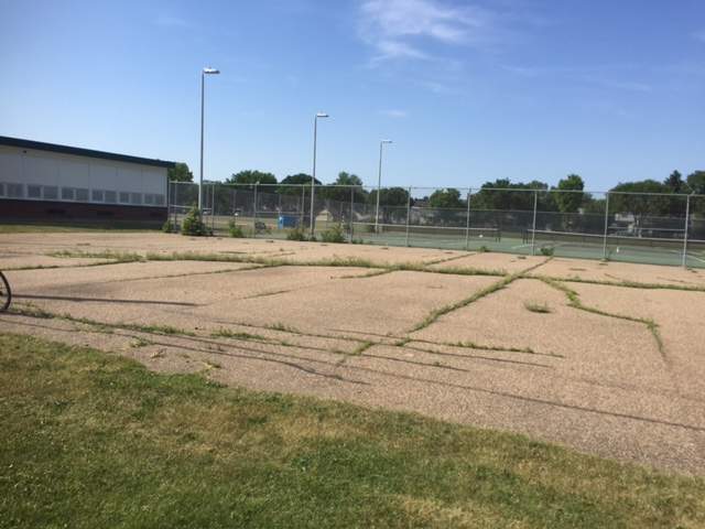 The Allendale Community League wanted to turn this unusable asphalt pad into a community garden.