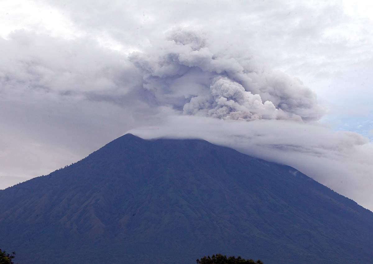 Mount Agung volcano spews smoke and ashes in Karangasem, Bali, Indonesia, Wednesday, Nov. 29, 2017.