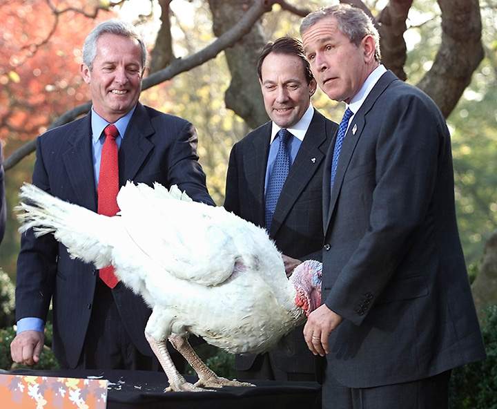 U.S. President George W. Bush, joined by turkey farmers, meets Liberty, the turkey to receive the annual Thanksgiving Presidential Pardon in the Rose Garden of the White House, Nov. 19, 2001.