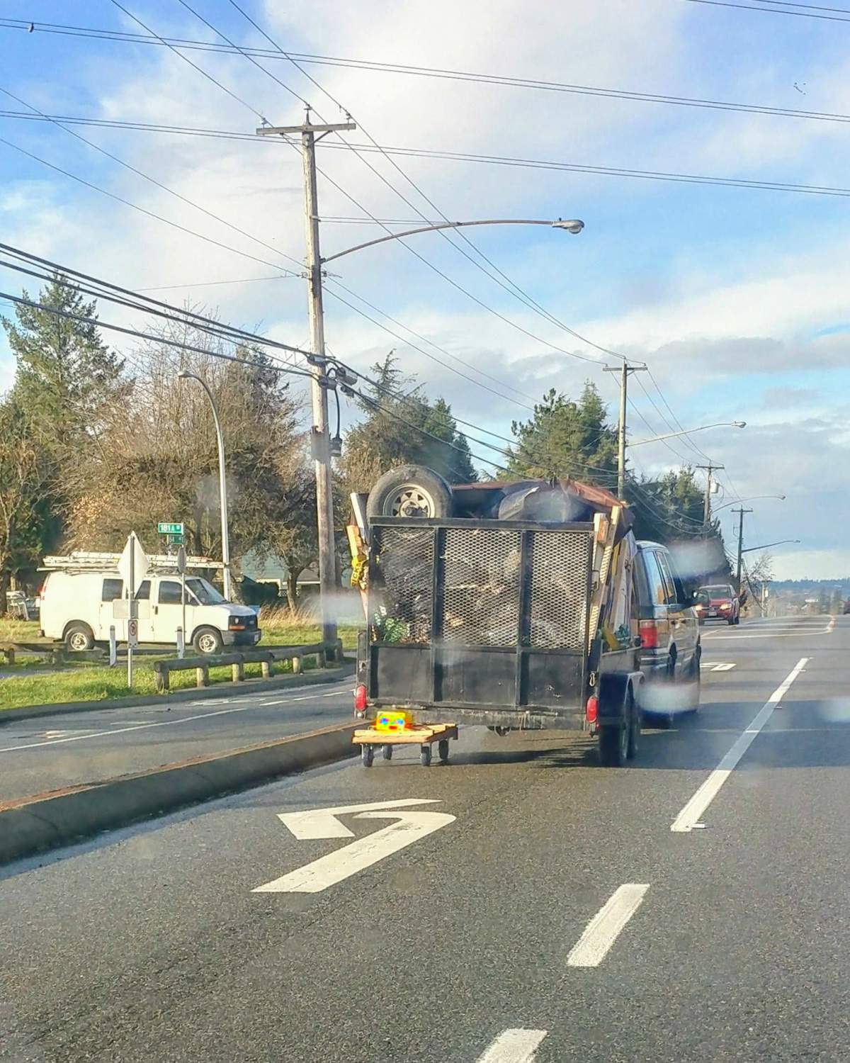 A trailer that appeared to have a dolly replacing its left wheels in Surrey on Nov. 16, 2017.