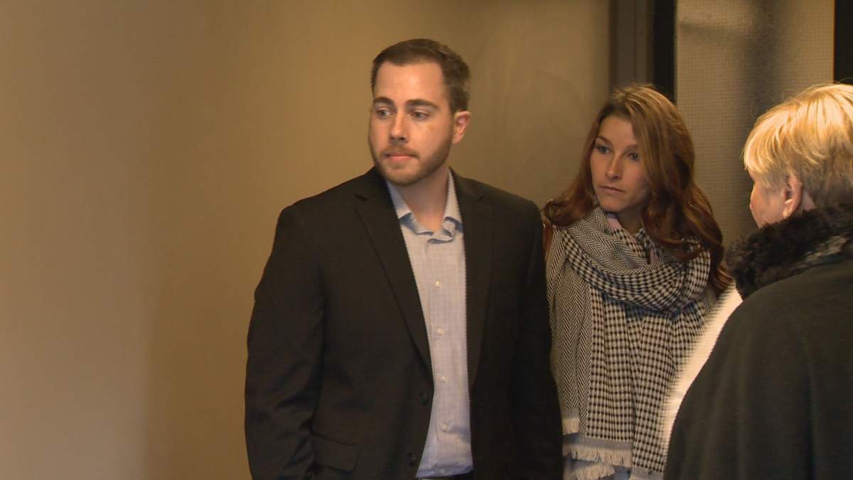 Christopher Garnier waits for the courtroom to open on the second day of his trial. 