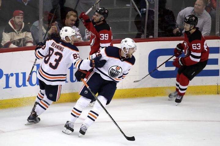 Edmonton Oilers center Leon Draisaitl (29), of Germany, and defenseman Matt Benning (83) celebrate Draisaitl's goal against the New Jersey Devils during overtime of an NHL hockey game, Thursday, Nov. 9, 2017, in Newark, N.J. The Oilers won 3-2. 