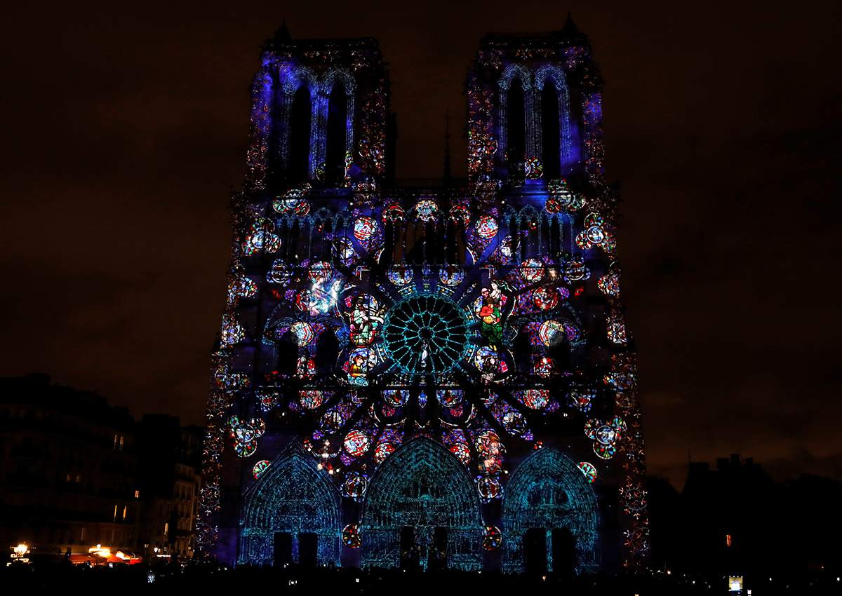 Notre-Dame de Paris Cathedral is illuminated in Paris on November 11, 2017, during a light show as part of the Armistice Day commemorations marking the end of WWI (World War One).