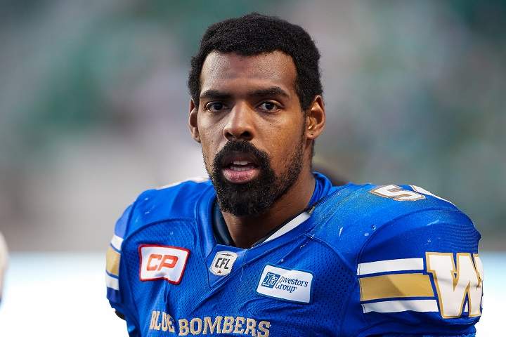 Tristan Okpalaugo of the Winnipeg Blue Bombers stands on the sideline during a pre-season game against the Saskatchewan Roughriders at Mosaic Stadium on June 10 in Regina.