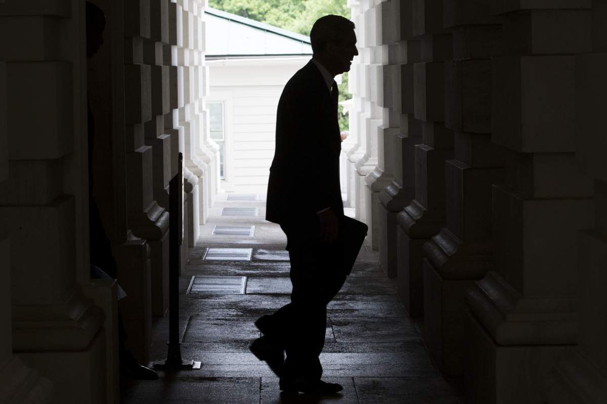The silhouette of Robert Mueller is seen as he leaves the U.S. Capitol Building following a meeting with the Senate Judiciary Committee in Washington, D.C., U.S., on Tuesday, June 20, 2017. 