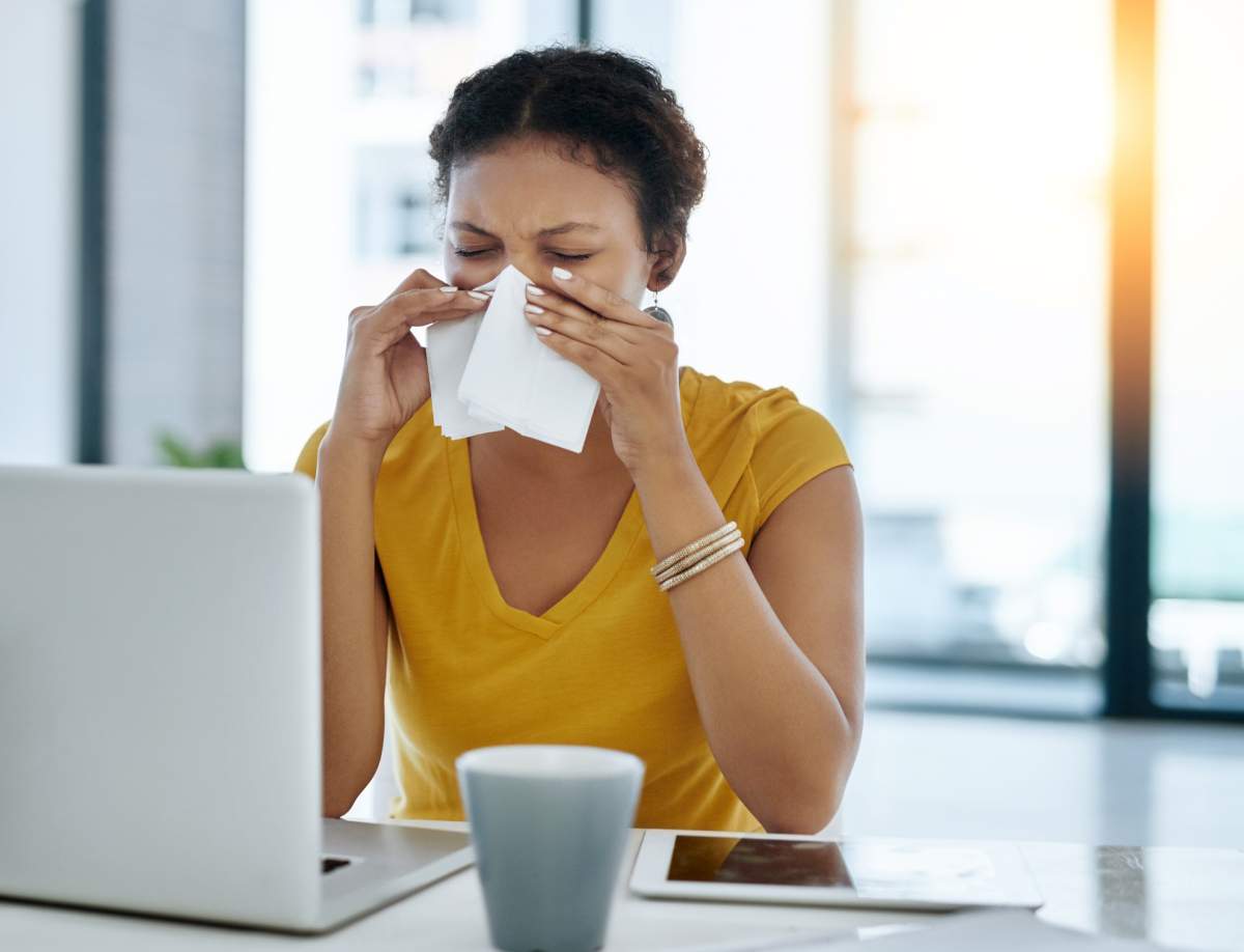 woman blowing nose