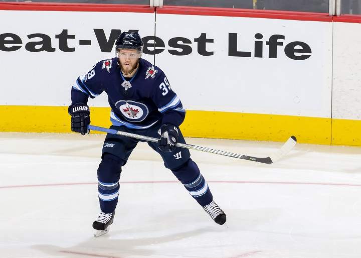 Toby Enstrom of the Winnipeg Jets keeps an eye on the play during a game against the Montreal Canadiens at Bell MTS Place on Nov. 4 in Winnipeg.