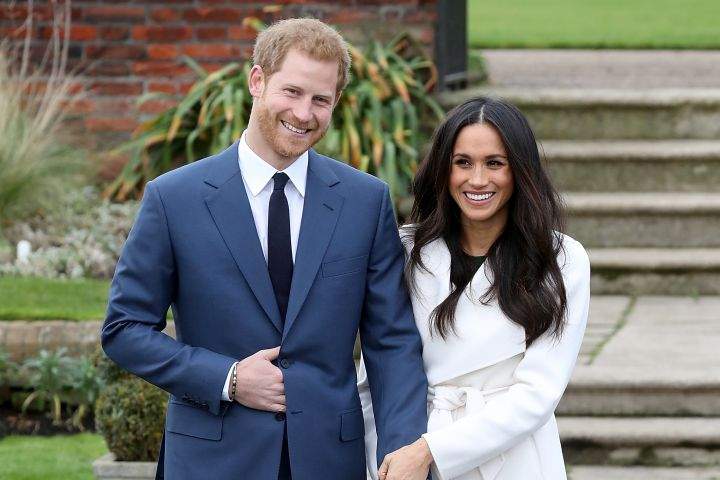 Prince Harry and Meghan Markle posing for photos in the Sunken Garden at Kensington Palace on Nov. 27.