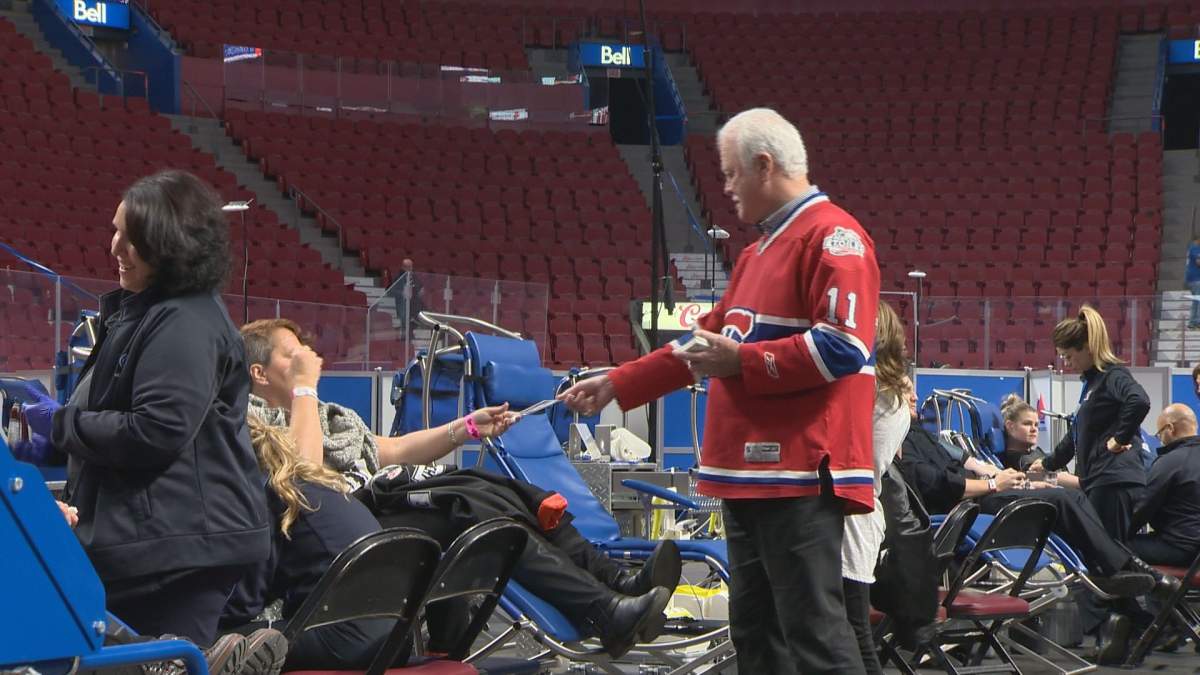 Former Habs forward Yvon Lambert hands out autographs during the annual blood drive Monday, Nov. 13, 2017.