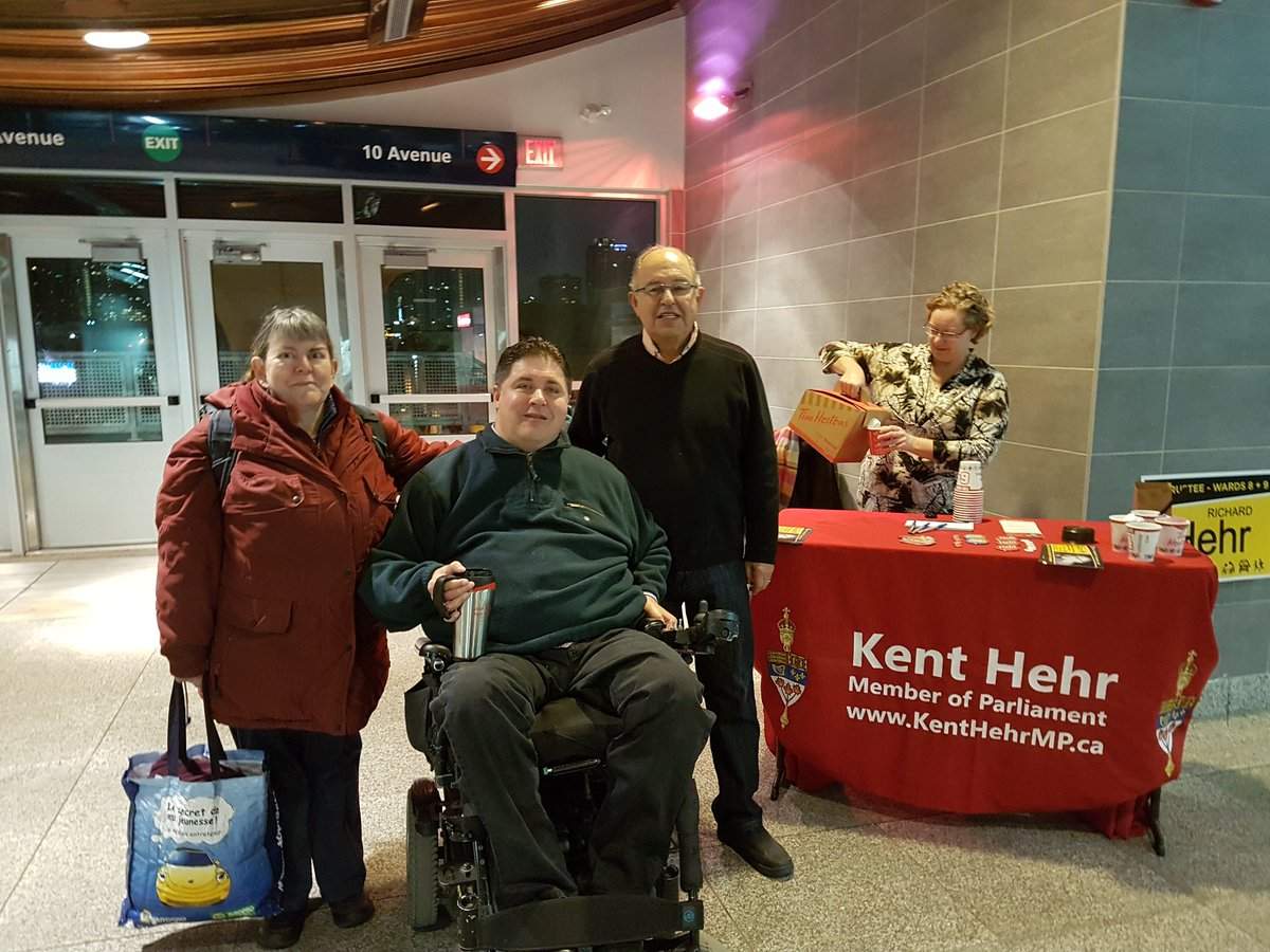 Liberal minister Kent Hehr is pictured here at an Oct. 13 campaign event  for his father's run at a Calgary LRT station. Conservative MPs say Hehr's use of parliamentary resources to support his father's election violate several federal rules. 