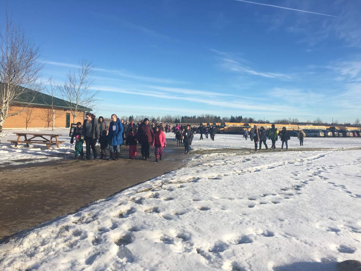 Wow here they come! All of these kids are in for a special Christmas today. Presents, winter clothes, food and a visit from Santa!