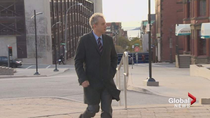 FILE - Dennis Oland is seen entering the courthouse in Saint John in this file photo.