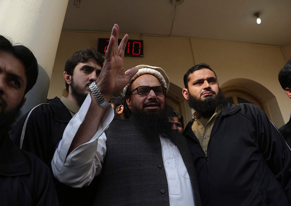 Hafiz Saeed, head of the Pakistani religious party, Jamaat-ud-Dawa, waves to his supporters at a mosque in Lahore, Pakistan, Friday, Nov. 24, 2017. 