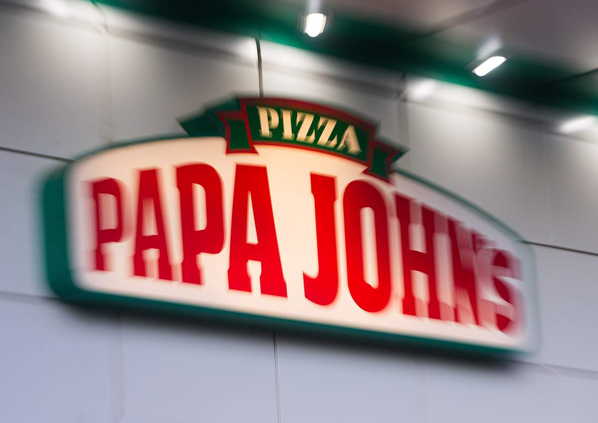 A sign at a Papa John's pizza restaurant.