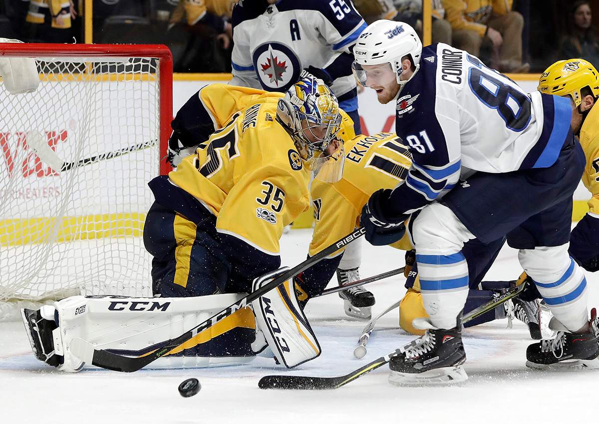 Nashville Predators goalie Pekka Rinne (35), of Finland, blocks a shot by Winnipeg Jets left wing Kyle Connor (81) in the third period of an NHL hockey game, Monday, Nov. 20, 2017, in Nashville, Tenn.