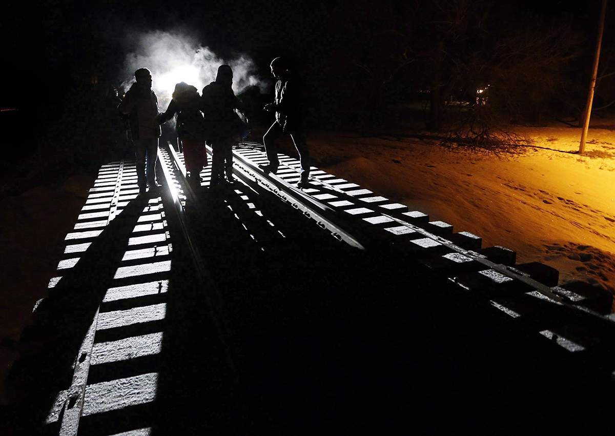 Early Sunday morning, February 26, 2017, eight migrants from Somalia cross into Canada illegally from the United States by walking down this train track into the town of Emerson, Man., .