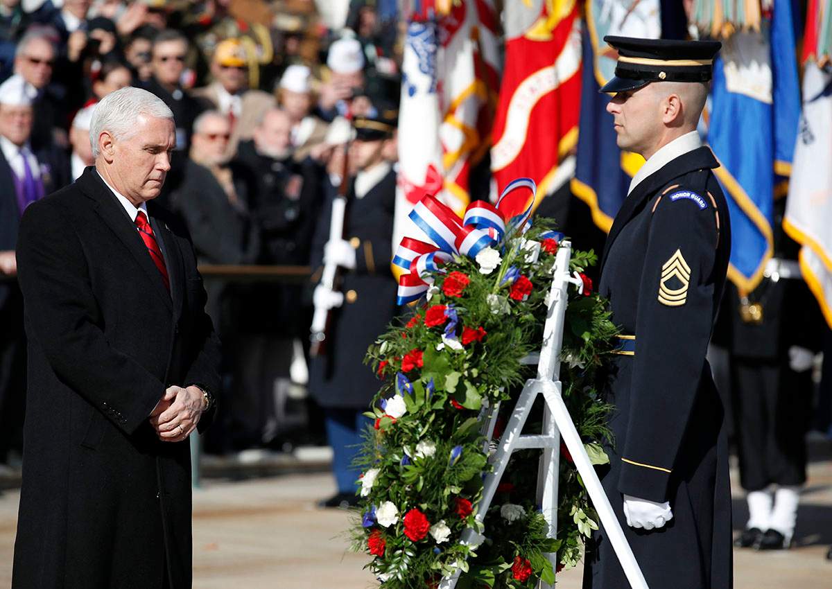 Vice President Mike Pence pauses after placing a wreath at the Tomb of the Unknown Soldier during a ceremony at Arlington National Cemetery on Veterans Day, Saturday, Nov. 11, 2017 in Washington.