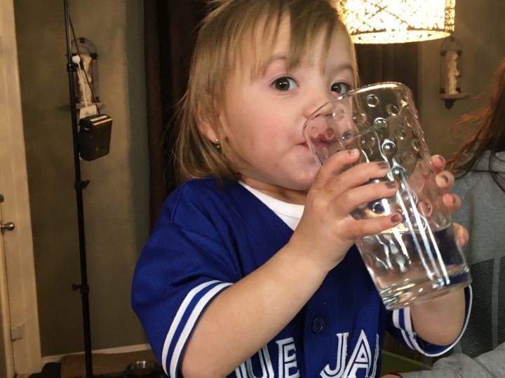 Miranda Collier’s 2-year-old daughter takes a big swig of water.