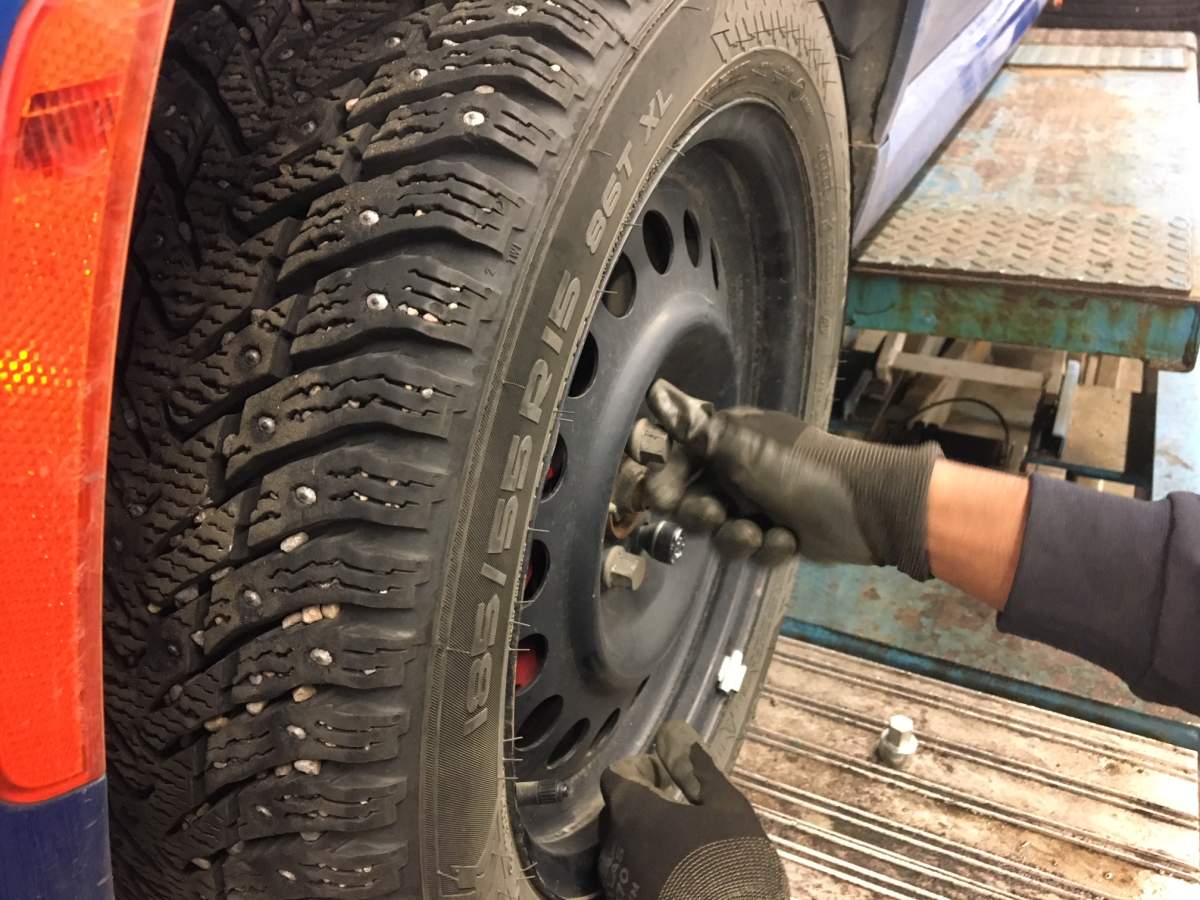 A winter tire being installed on a car at a Kal Tire shop in Edmonton, Alta. November 1, 2017.
