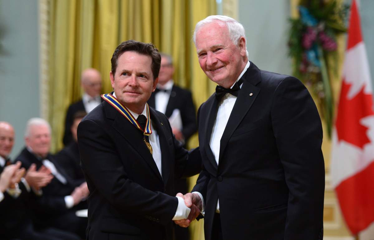 Governor General David Johnston presents Michael J. Fox with the Lifetime Artistic Achievement (Broadcasting) award during the Governor General’s Performing Arts Awards ceremony at Rideau Hall in Ottawa on Wednesday, June 28, 2017. THE CANADIAN PRESS/Sean Kilpatrick