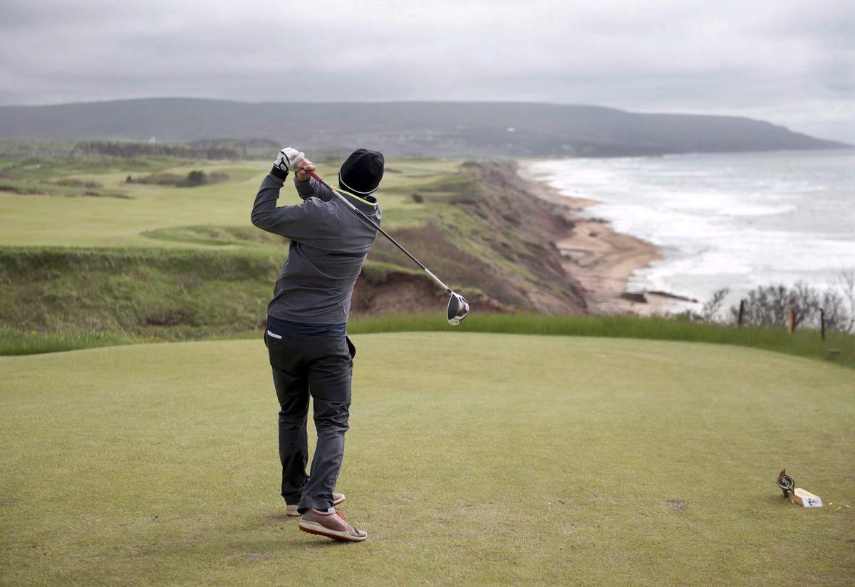 A golfer hits from the tee on the 528 yard, par 5, 18th hole at Cabot Cliffs in Inverness, N.S. on Wednesday, June 1, 2016. 